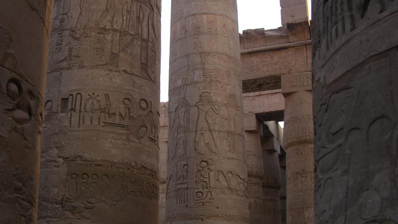Tall columns carved with Egyptian illustrations of religion and royal life