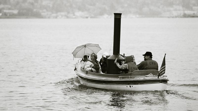 Photograph of a small wooden boat in the water 