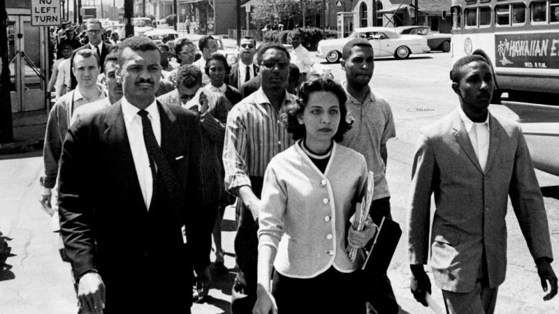 Nashville Freedom Riders walk down the street in a group, with Diane Nash at the front