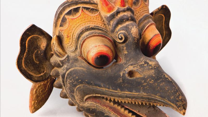 Bird mask with long beak and teeth, painted in brown, gold and orange