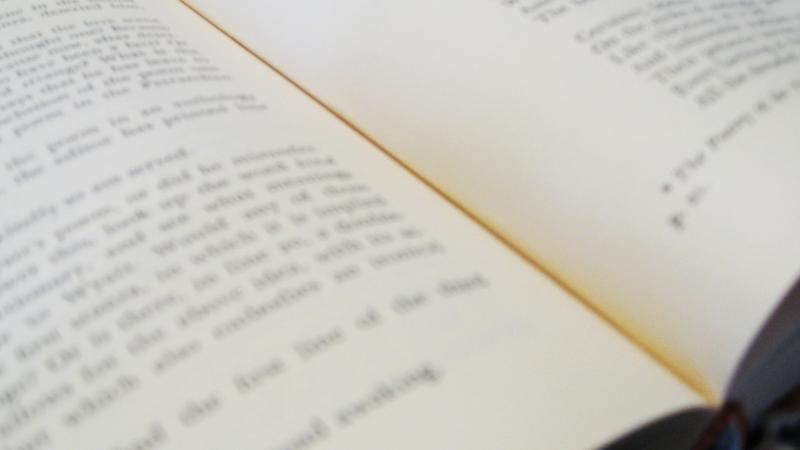 Close view of an open book of poetry