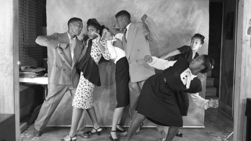Black and white photo of several African Americans performing as pantomimes.