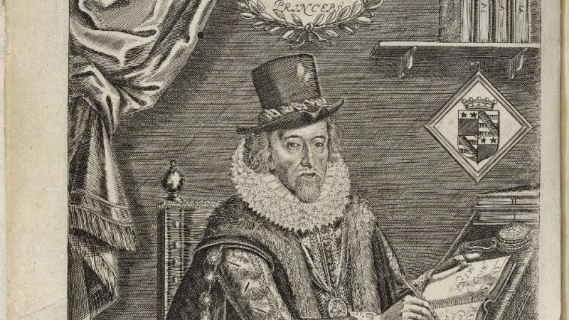 Sir Francis Bacon sitting at a desk, writing with a quill pen, dressed in a robe, fur scarf, top hat, and high ruffled lace collar