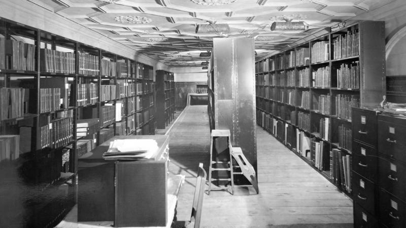 Black and white photo of an underground reference library.
