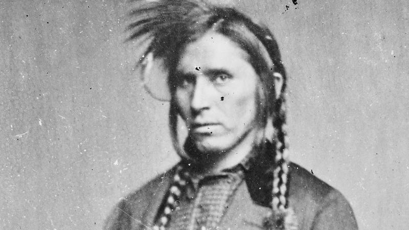 Black and white photo portrait of a Native-American man.