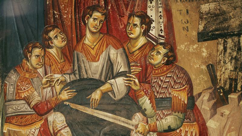 Fresco of five soldiers sitting and dividing the coat of Christ.