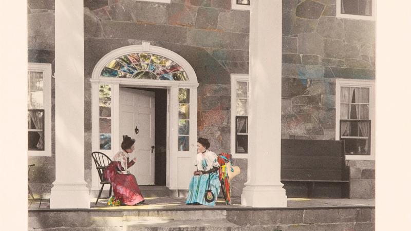 Color illustration of two old ladies conversing on the porch of a large house with front columns.