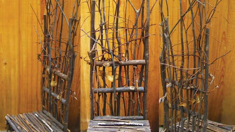 Photo of three chairs made of tree branches with a plywood background and the text "Not Exactly a Hermit" written at the bottom.