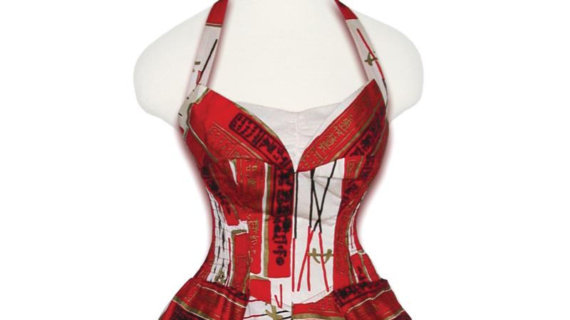 A red dress with a sweetheart neckline and full skirt, patterned with chopsticks and chinese characters