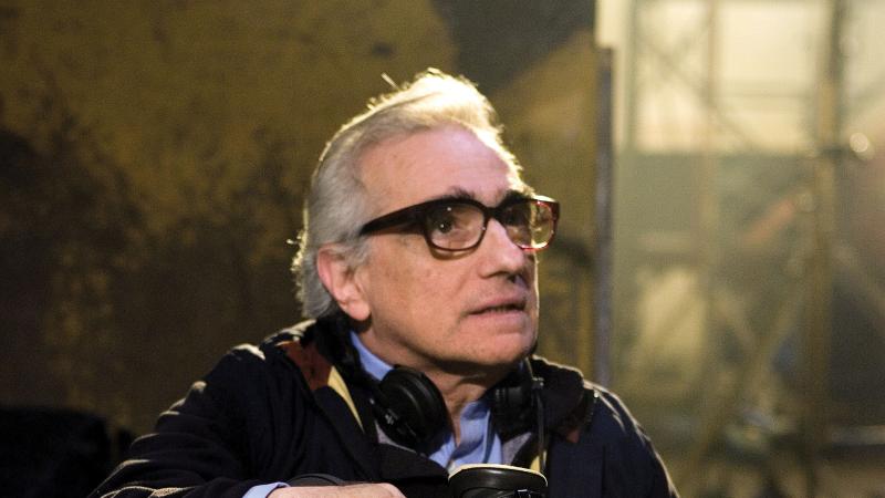 Photograph of martin scorsese with headphones around neck