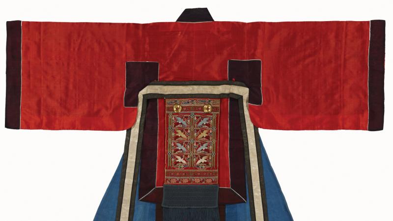Robe, laid flat, with red sleeves and blue coat, edged with black and embroidered