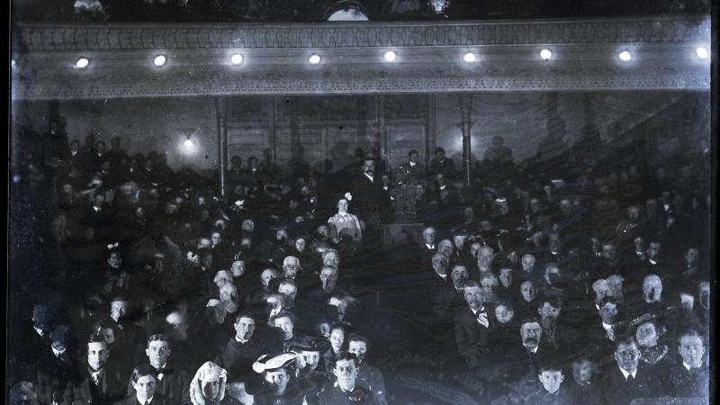 Black and white photo of an early cinema in Iowa, full of viewers.