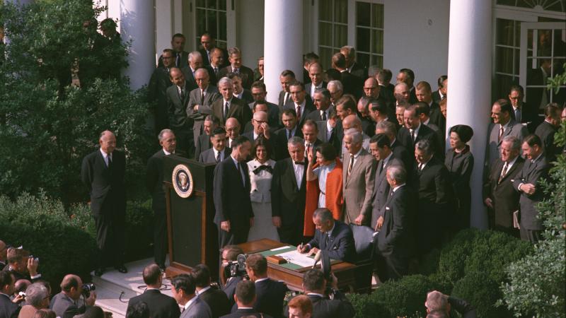 Color photo of the ceremony where President Lyndon Johnson signed the NEH into law.