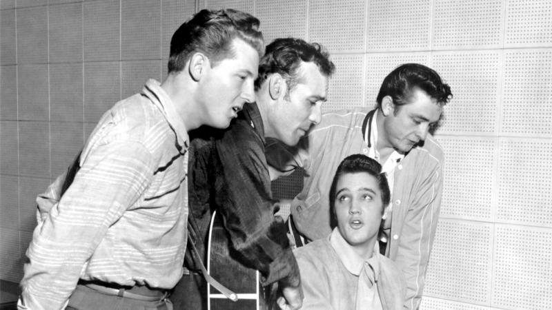 Jerry Lee Lewis, Carl Perkins, Elvis Presley and Johnny Cash singing, while Elvis plays the piano