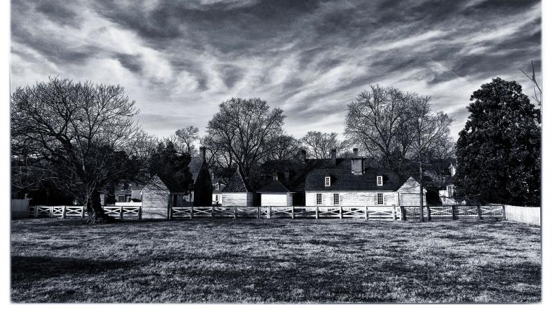 Old Williamsburg homes, under a cloudy sky