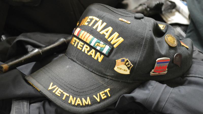Color photo of a black baseball cap that says "Vietnam Veteran" on it.