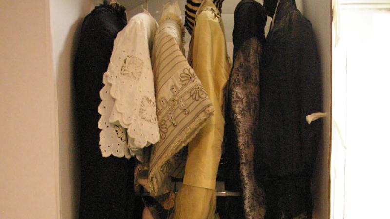 Newly rehoused hanging garments in individual archivally-safe wardrobe boxes.