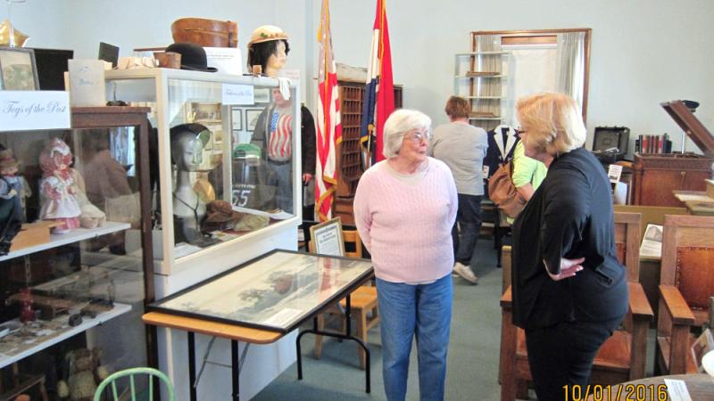 Visitors in the upstairs gallery of the Adair County Historical Society.