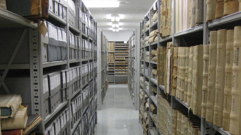 photograph of hallway with filing and shelves on each side