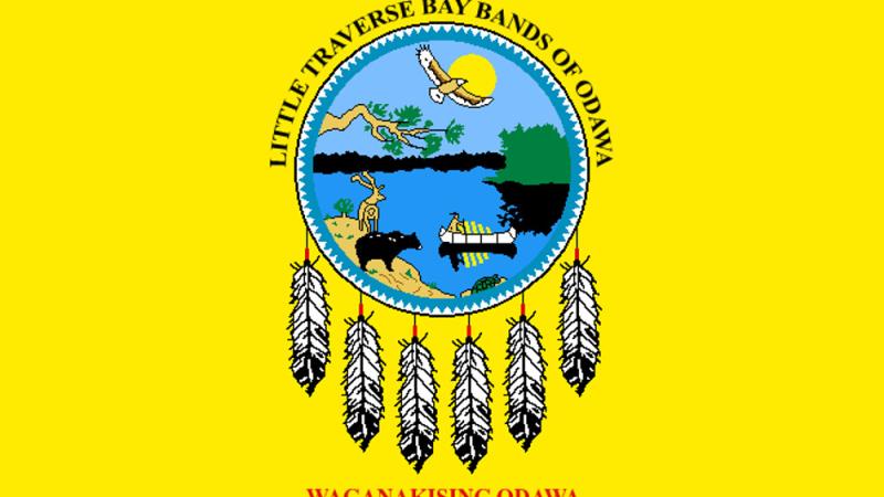 Yellow background with blue circle, flag of Little Traverse Bay Bands of Odawa Indians