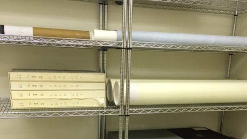 photo of paper materials on shelves