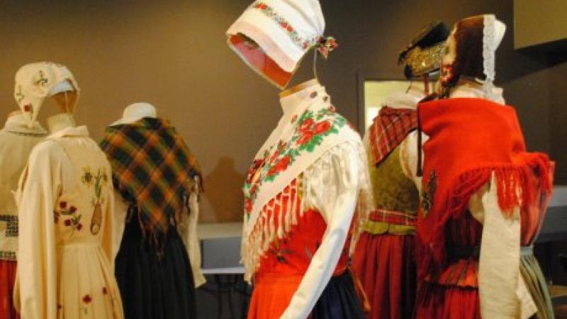 photograph of various mannequins with costumes