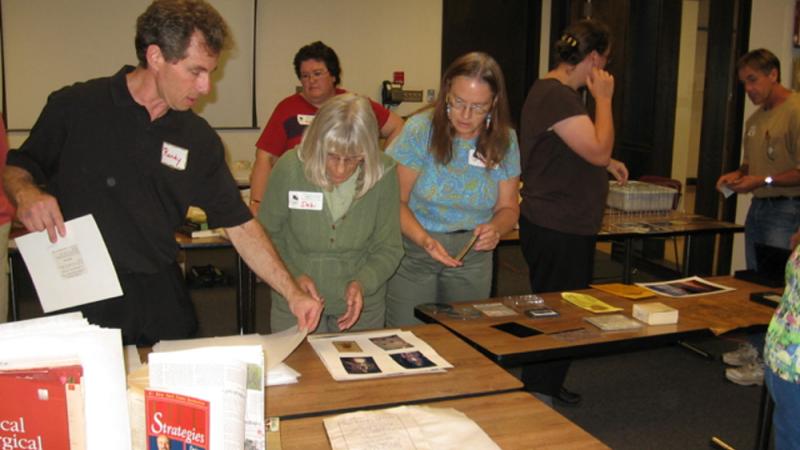 Randy Silverman demonstrating drying techniques for paper-based records and book