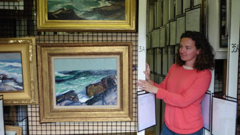 Jennifer Pye, Curator of Collections, showing the custom painting racks.