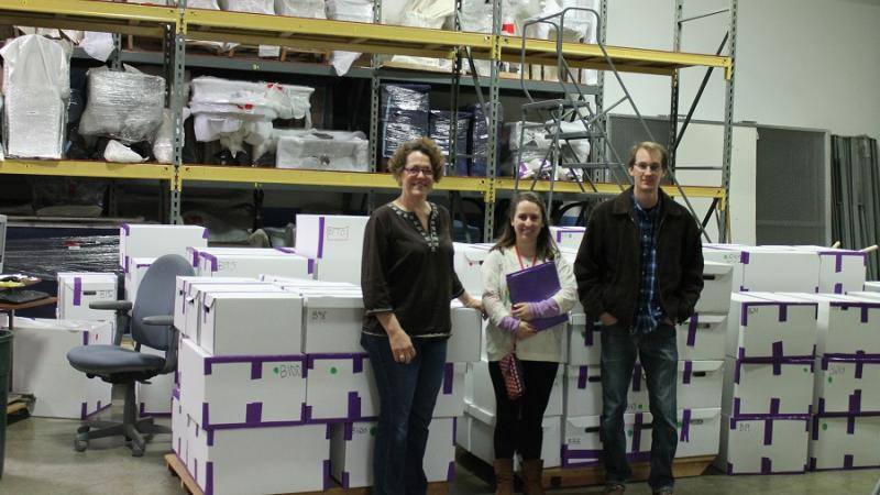 Staff with boxes at storage facility