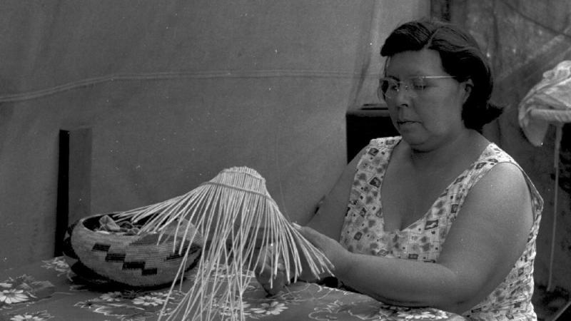 Essie Parrish weaving baskets, c. 1960s.