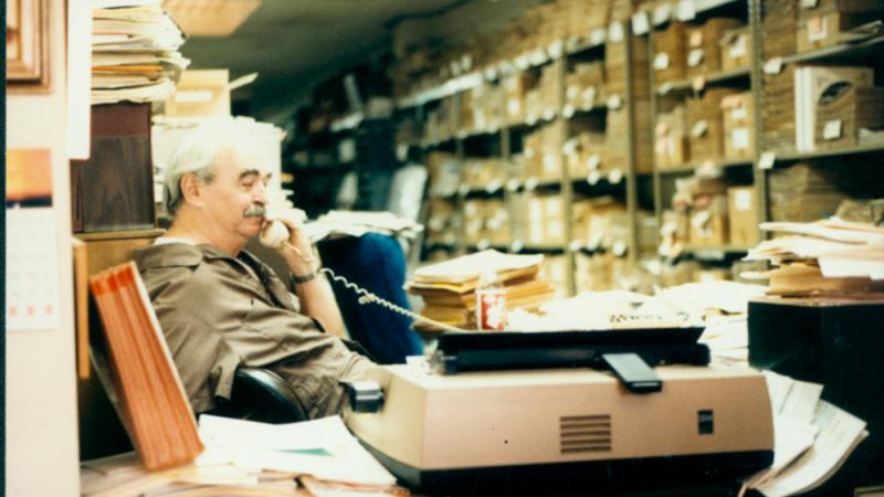 Jim Kepner on the phone at the National Gay Archives. 1986.