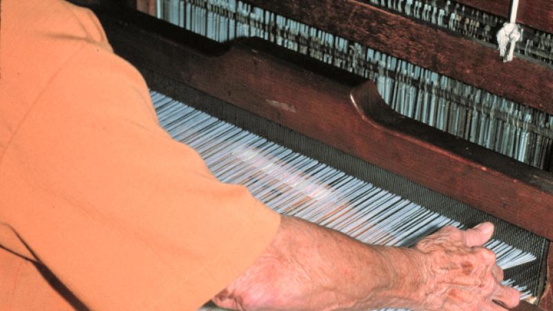 Photograph of master weaver Dorothy Thompson at a loom