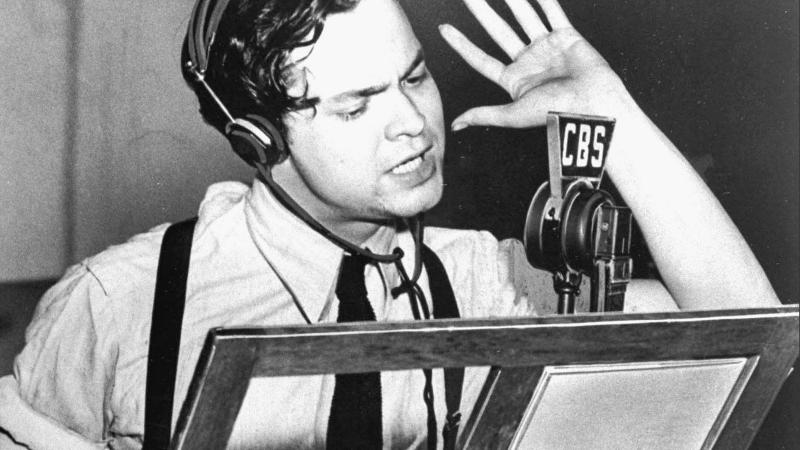 Orson Welles at microphone