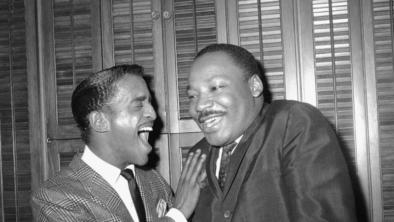 Sammy Davis Jr. in a lighthearted exchange with Martin Luther King Jr.