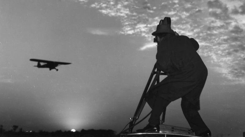 Cameraman with plane