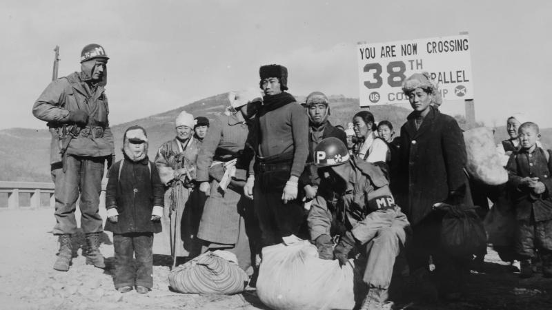 Refugees are checked for contraband by U.S. soldiers at 38th Parallel in 1950