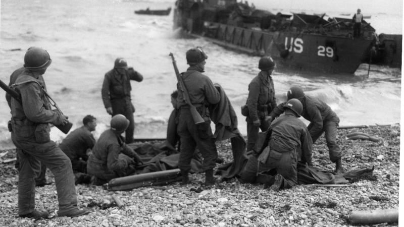 D-Day troops get first aid on the beach
