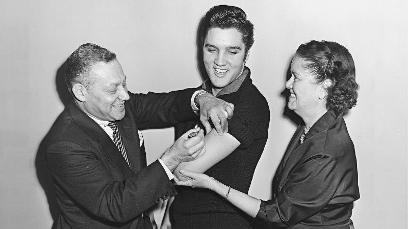 Elvis Presley receiving the polio vaccine. 