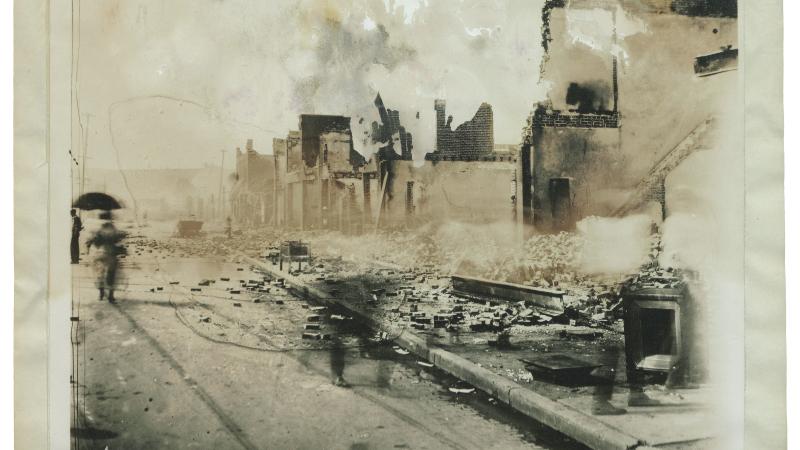 A blurred photo of the ruins of Greenwood after the 1921 Tulsa Massacre