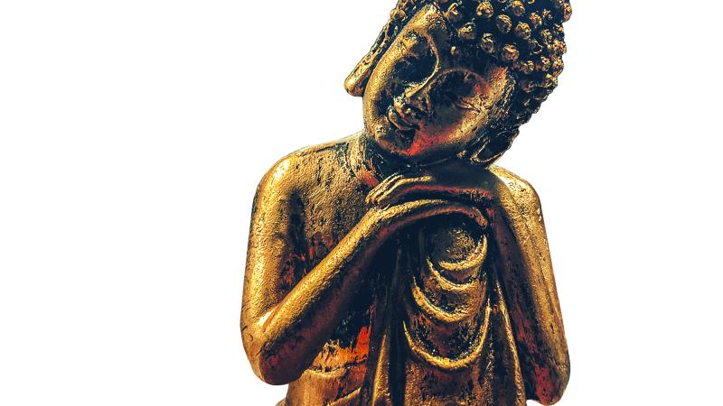 gold statue of leaning Buddha