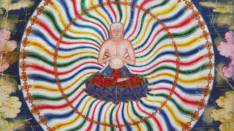 Painting of a meditating Buddha in the center of a colorful wheel. 