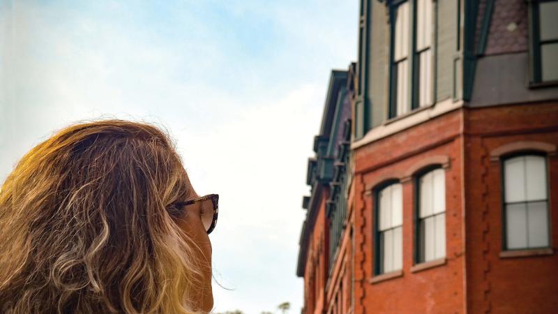 Woman in front of Brattleboro's Hotel Brooks.