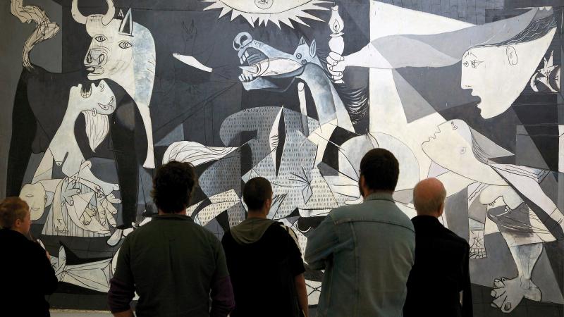 Group of people looking at Picasso's Guernica