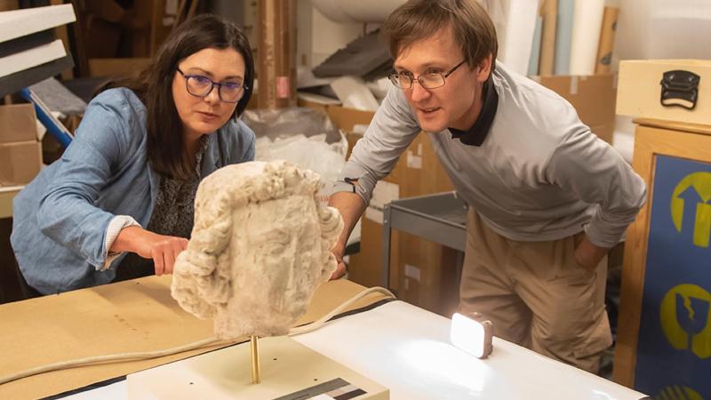 Jennifer Feltman and Alexandre Tokovinine documenting sculptures from Notre Dame