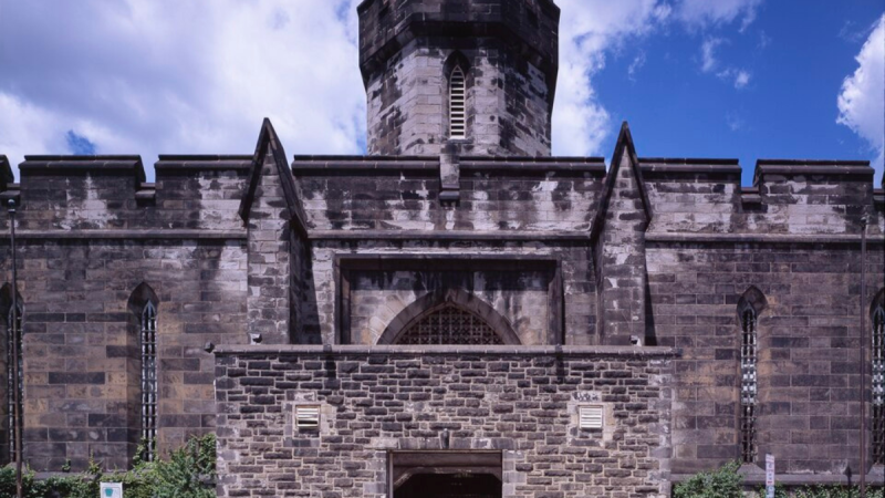 Outside the front gate of Eastern State Penitentiary on a sunny day